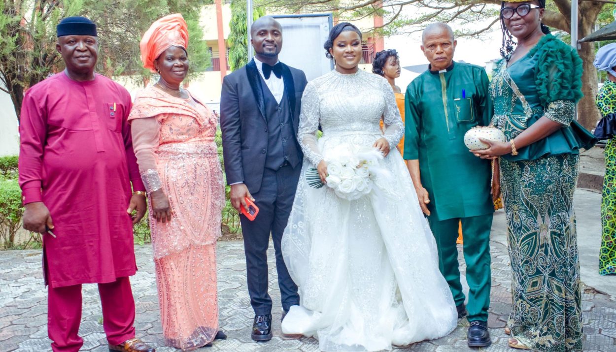 Couple with their parents. Right: Brides parents: Ven. Ngozi and Faith Ofoegbulam . Left: Pastor Chima and Elder Francisca Mbisike.